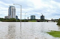 | Photo: AP/Maria Lysaker : Streets flood after Beryl made landfall